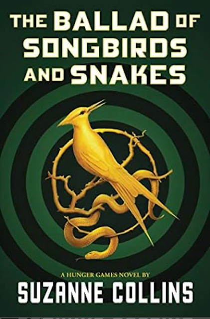 An image of the cover for The Ballad of Songbirds and Snakes. A gold songbird stands on a gold branch wreath, with a gold snake wrapped around the branches. The background is forest green with deeper rings creating a target shape.